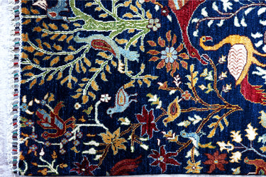 close up of a hand knotted medium tree of life arijana afghan rug