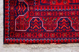 close up of a hand knotted small red khal mohammadi afghan rug