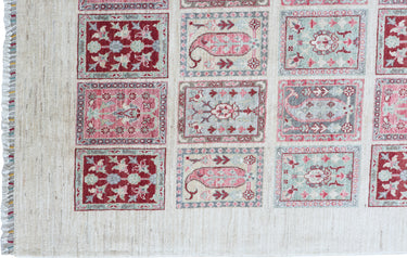 close up of hand knotted large pink white bakhtiari afghan rug