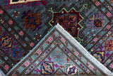 edge of hand knotted small purple ersari afghan rug