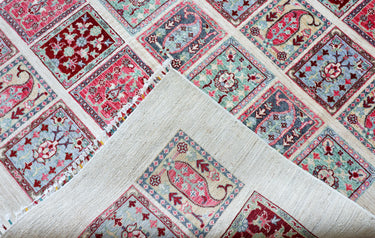 edge of hand knotted large pink white bakhtiari afghan rug